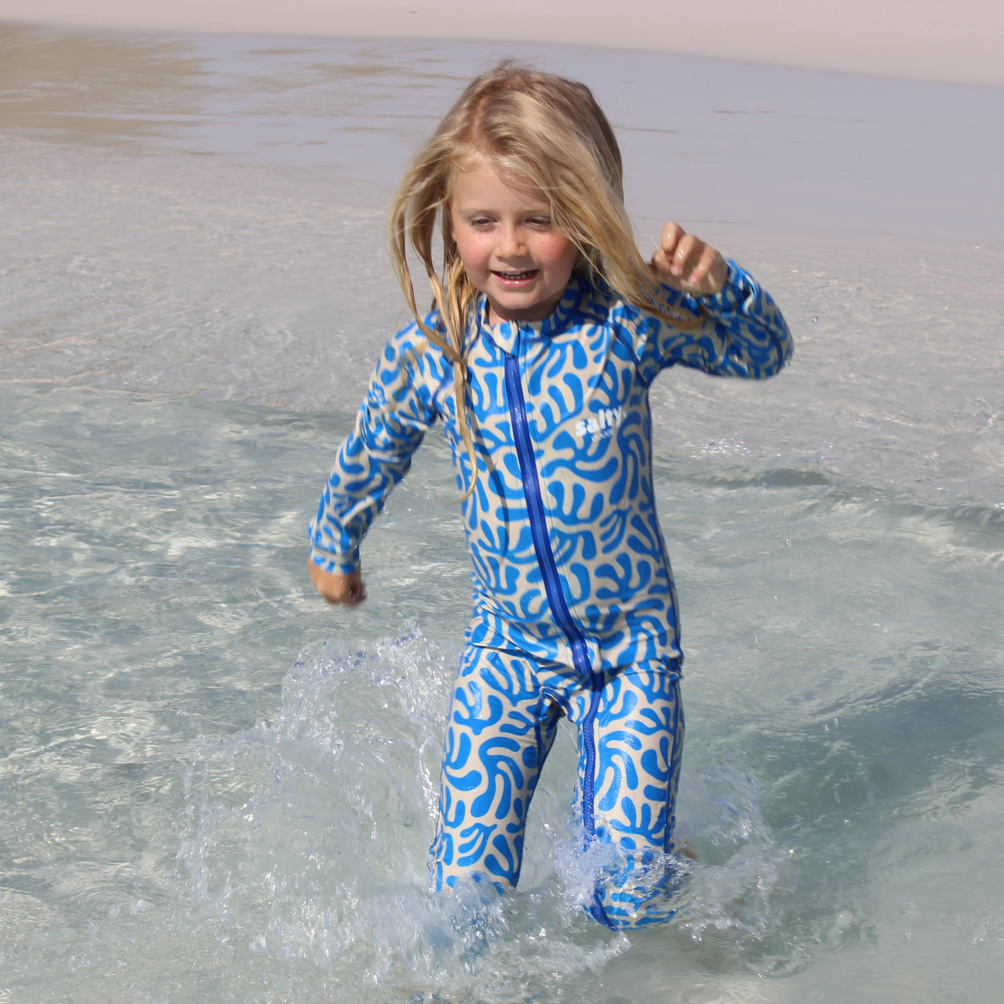 stinger suit australia beach sand blue suit