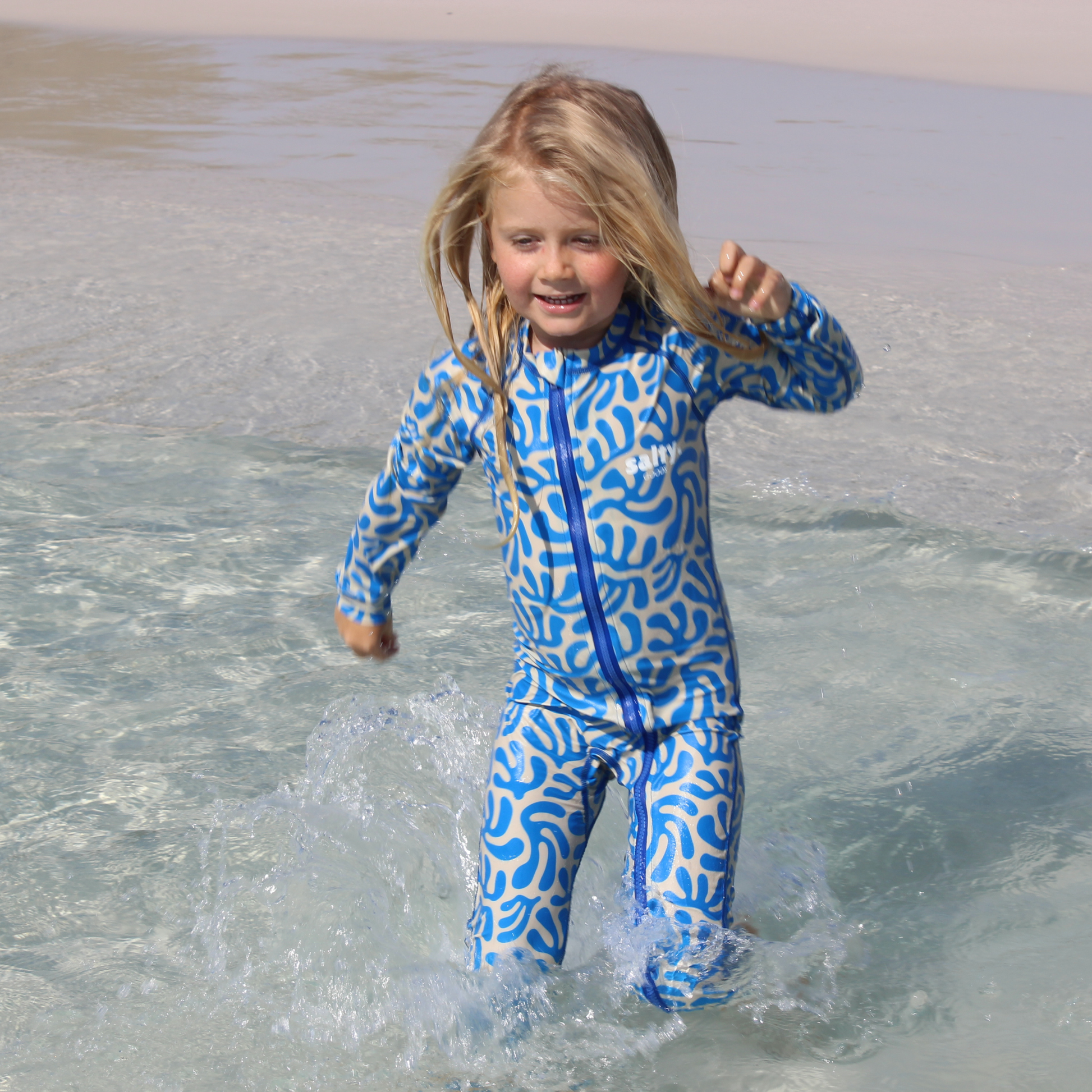 stinger suit australia beach sand blue suit